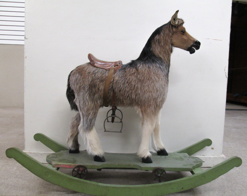 Appraisal: VINTAGE HIDE COVERED HOBBY HORSE in standing pose on wheeled