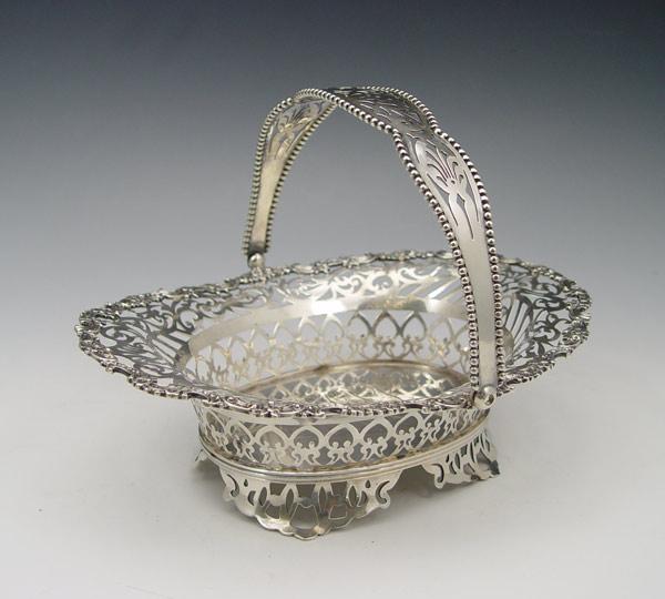 Appraisal: J E CALDWELL RETICULATED STERLING BASKET Openwork basket with articulated