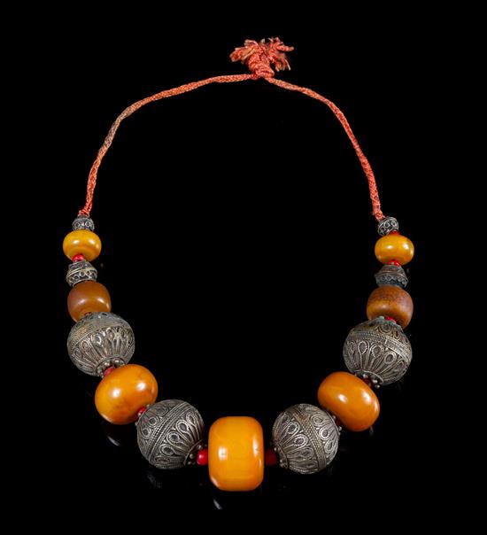 Appraisal: Sale Lot An Amber and Metal Beaded Necklace having seven