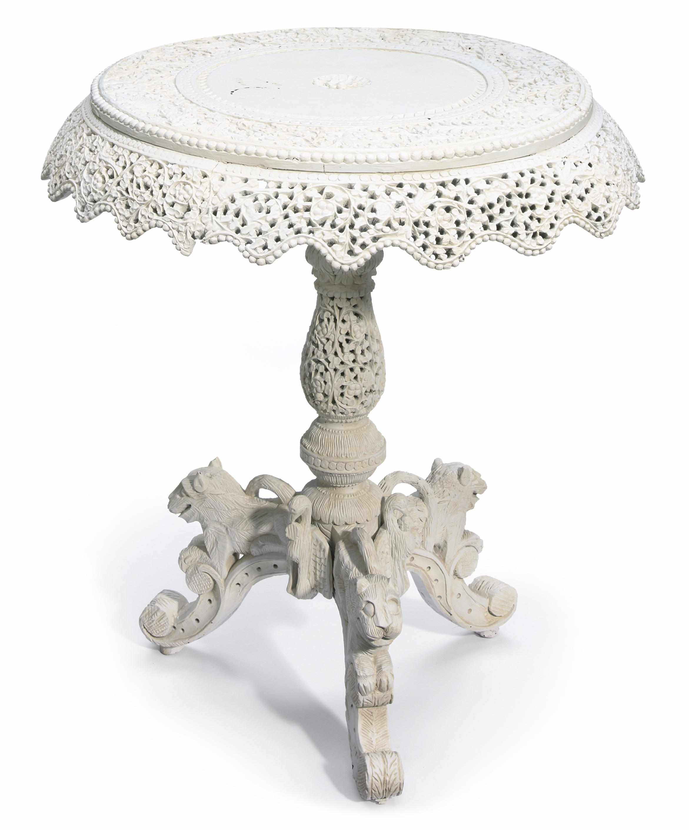 Appraisal: An Anglo Indian white painted pierced carved wood tripod table