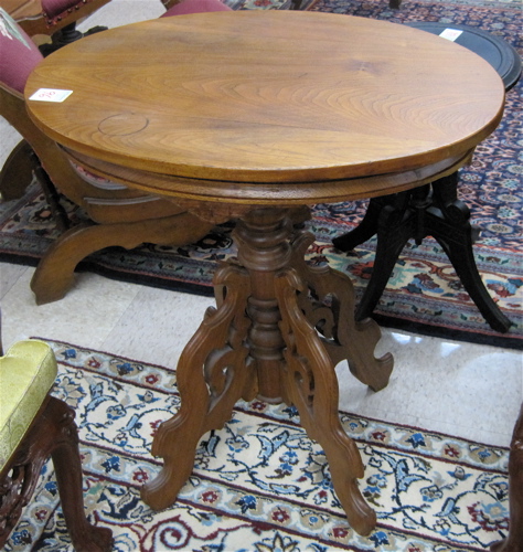 Appraisal: A VICTORIAN WALNUT LAMP TABLE American th century having an