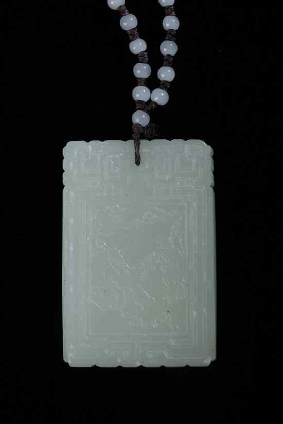 Appraisal: CHINESE CELADON JADE PENDANT Carved to depict flowering branch and