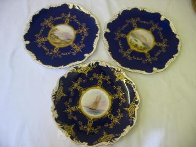 Appraisal: THREE COALPORT PORCELAIN PLATES painted with central roundel of Loch