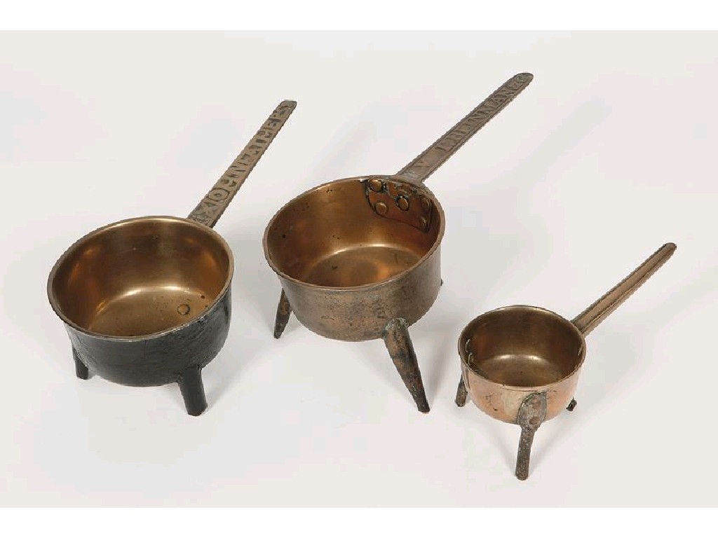 Appraisal: THREE BRONZE SKILLETS including two with cast handles V T