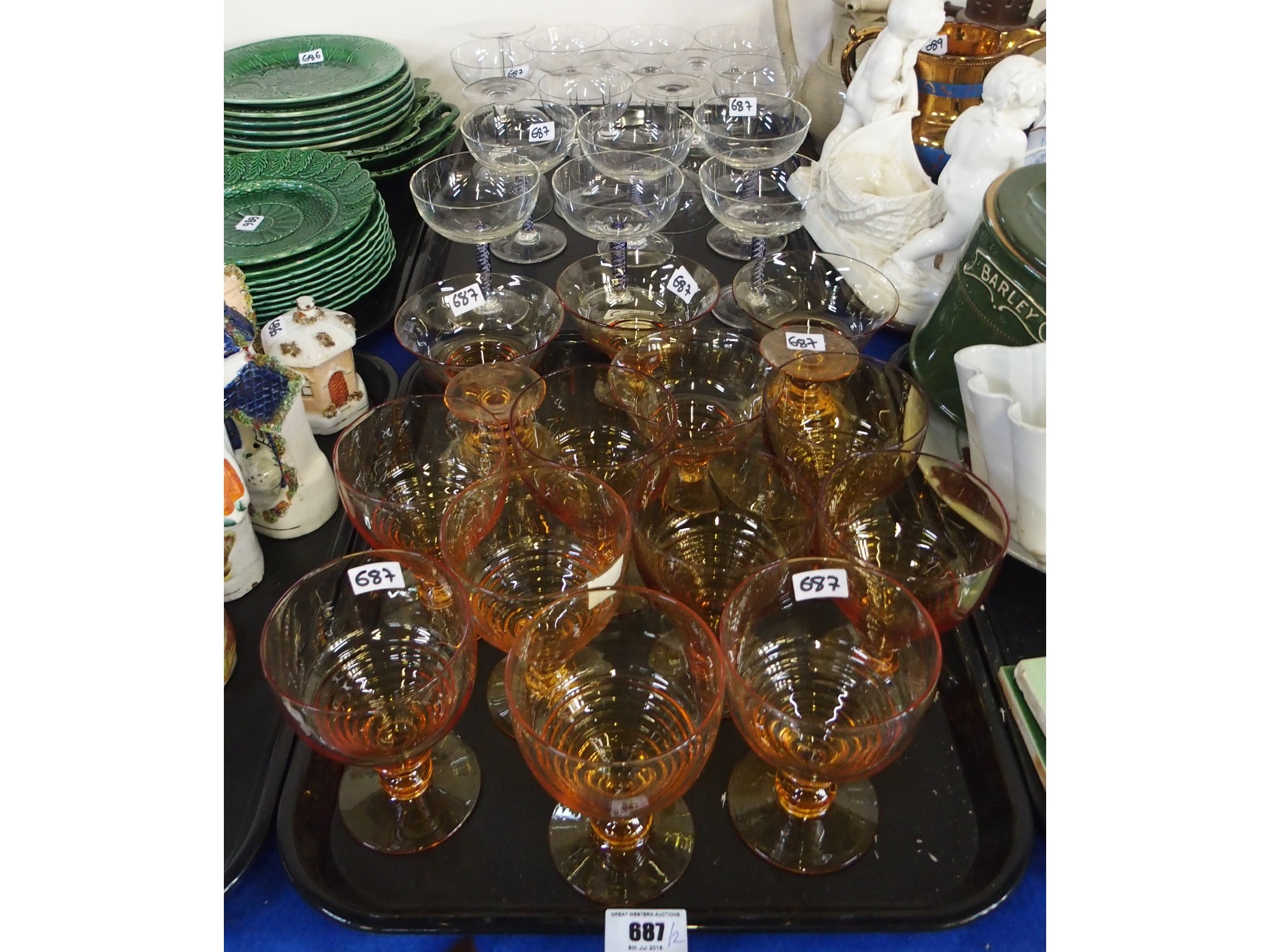 Appraisal: Six champagne glasses with blue air twist stems Stuart amber