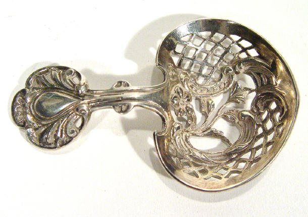 Appraisal: Victorian ornate pierced silver sugar spoon London cm in length