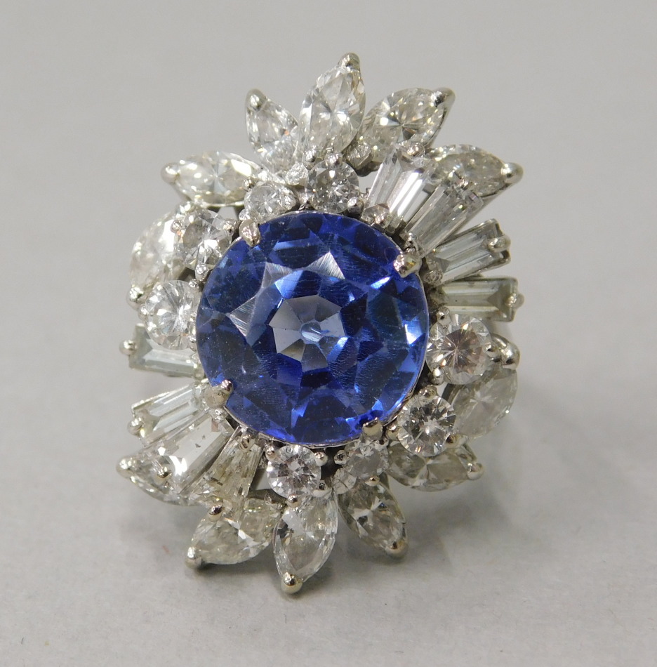 Appraisal: A diamond and sapphire possibly synthetic dress ring in abstract