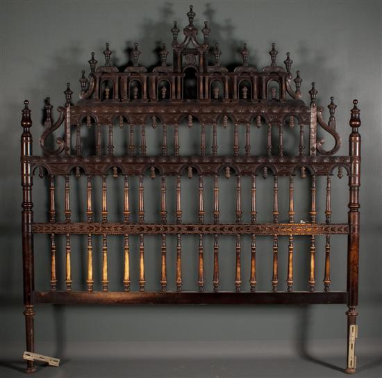 Appraisal: Spanish Colonial style turned and carved walnut headboard with elaborate