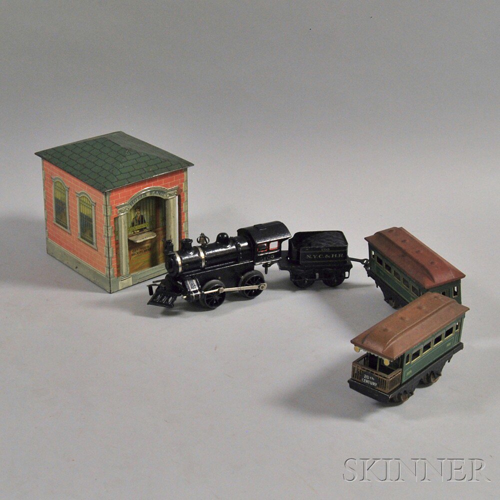 Appraisal: Small Group of Toy Trains and a Tin Bank four