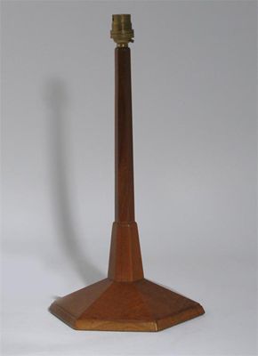 Appraisal: A Cotswold School walnut table lamp base tapering faceted section