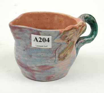 Appraisal: PEGGY WHITING Victoria circa Cylindrical earthenware branch handled jug applied