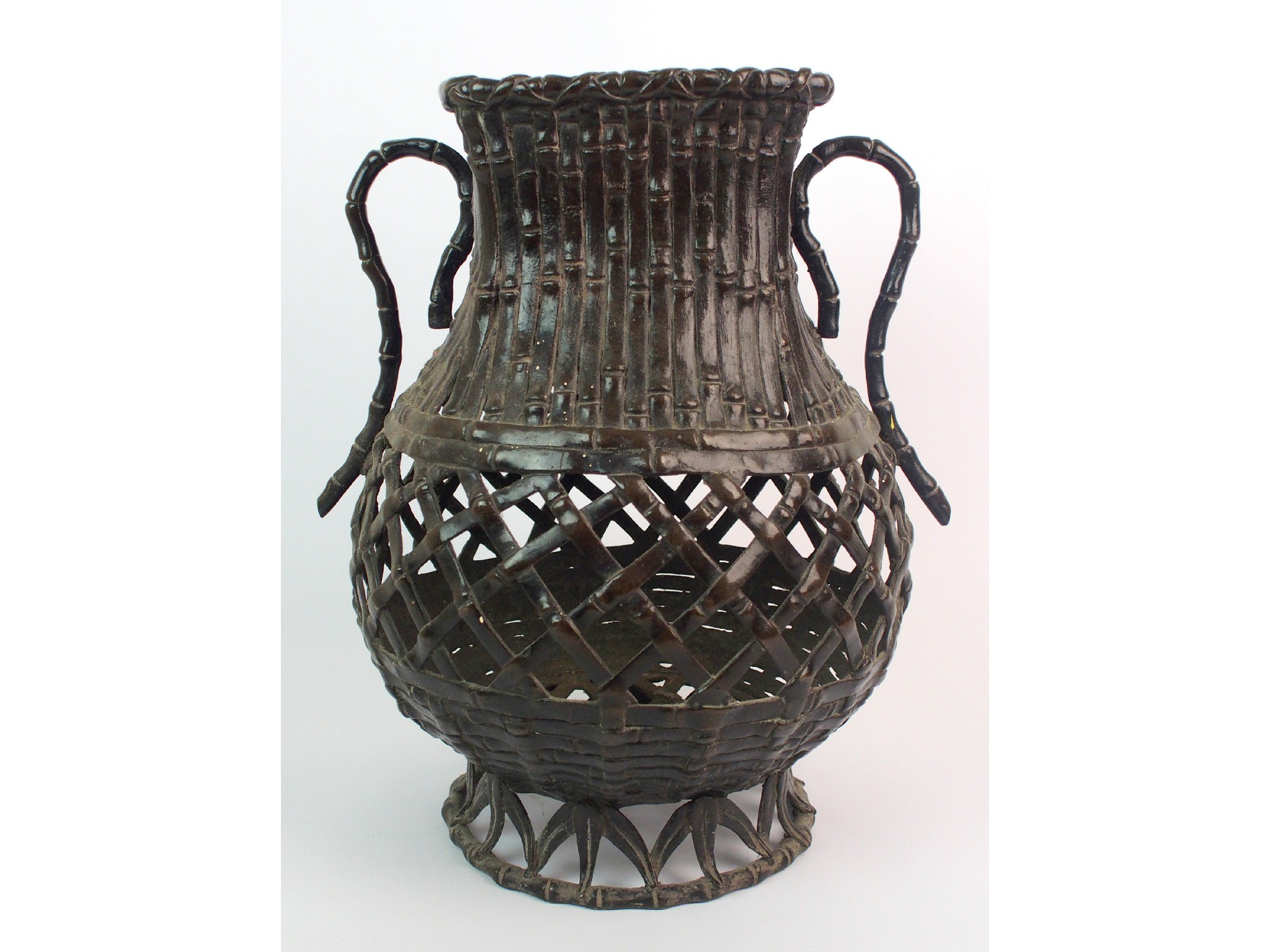 Appraisal: A Chinese bronze bamboo basket vasewith twin scroll handles on