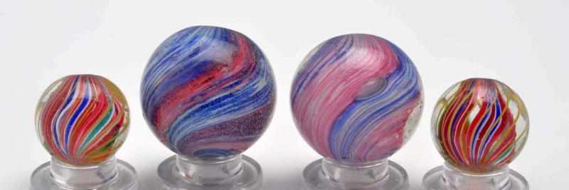 Appraisal: Lot of Same Cane Marbles Description The smaller marbles are