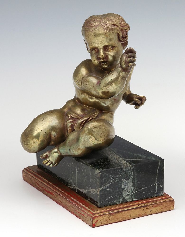 Appraisal: A CAST AND PINNED BRONZE PUTTO FIGURE ON MARBLE The