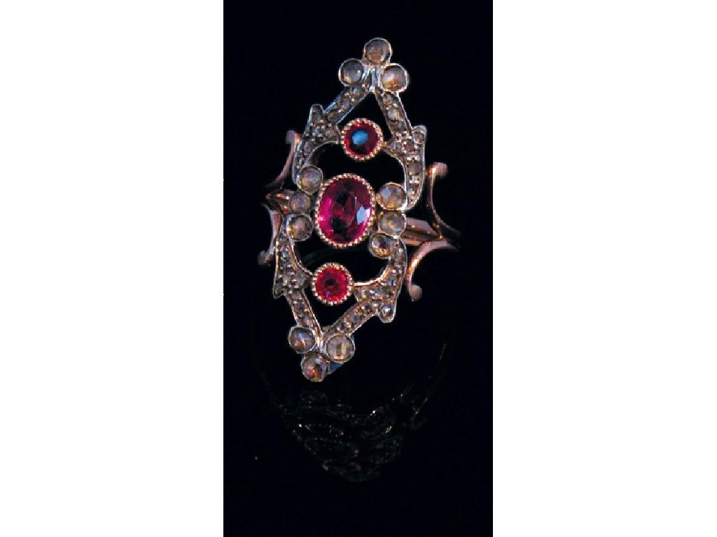 Appraisal: A CONTINENTAL STYLE DIAMOND AND GARNET RING collet-set to the