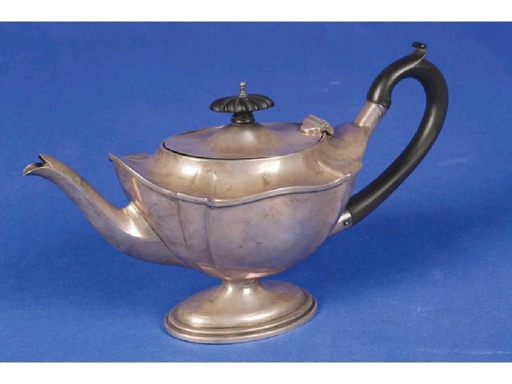 Appraisal: AN EDWARDIAN TEAPOT of shaped oval form with a scroll