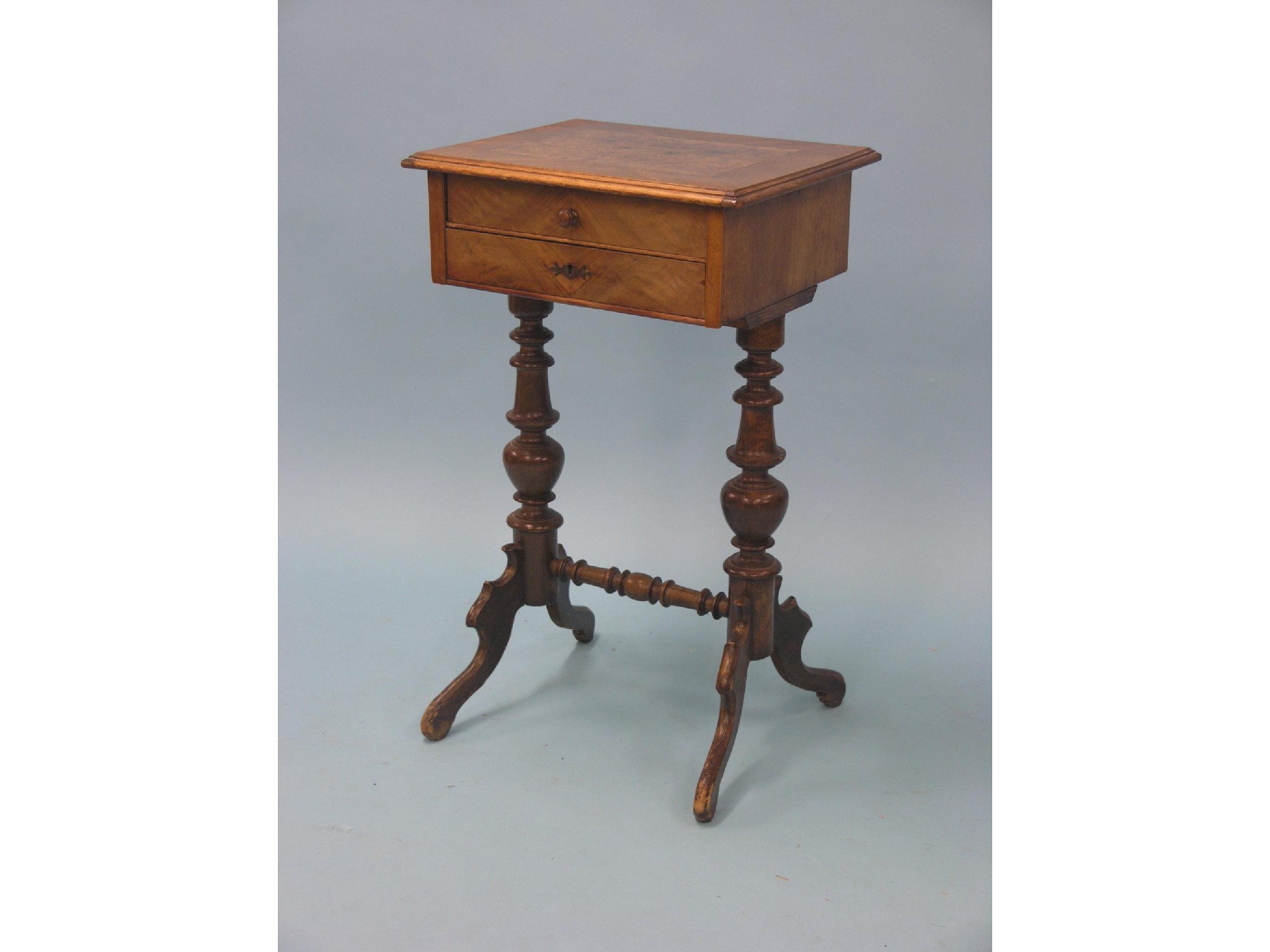 Appraisal: A Victorian walnut and burr walnut work table two shallow