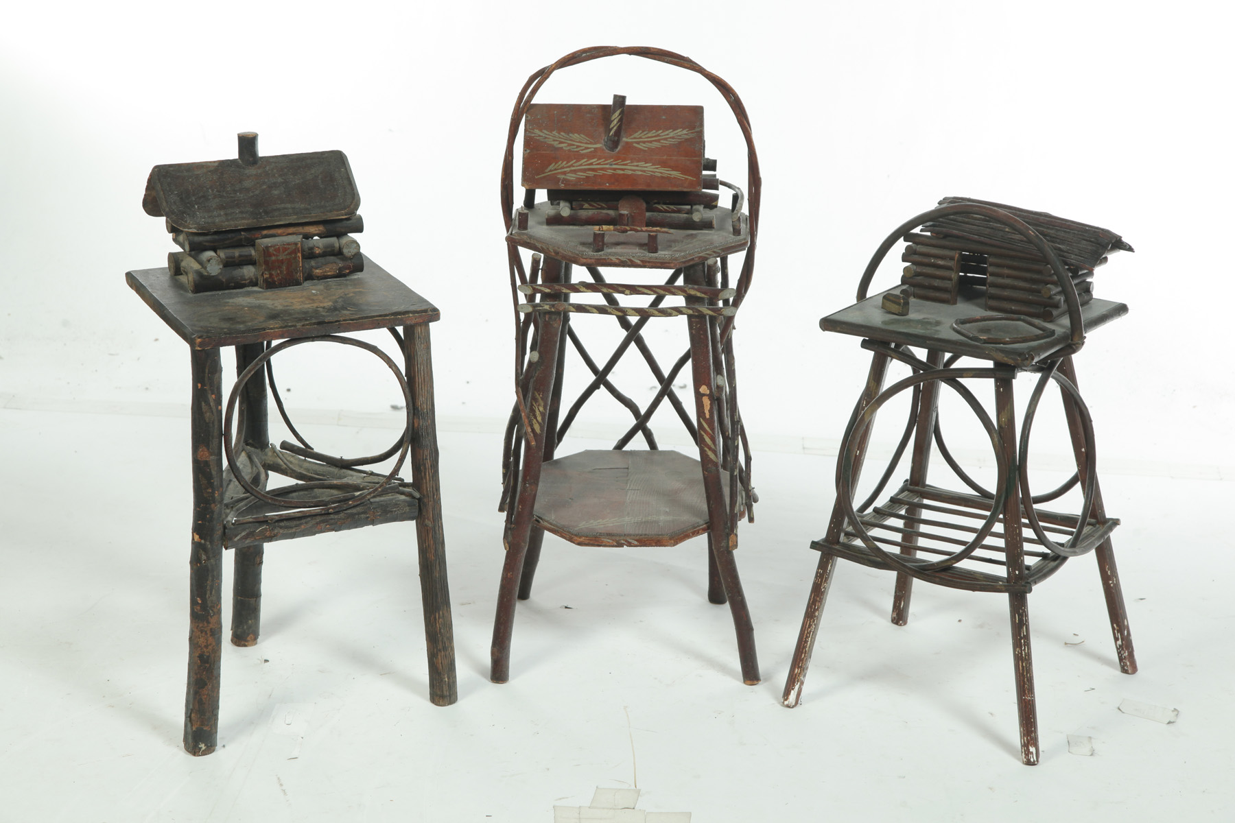 Appraisal: THREE TWIG SMOKING STANDS American st half- th century All