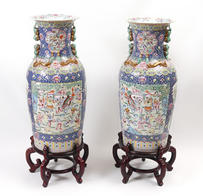 Appraisal: PAIR CHINESE TEMPLE VASES Profusely decorated with scenes of children