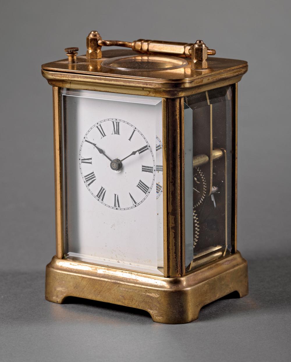 Appraisal: American Brass Carriage Clock c Waterbury Clock Co beveled glass