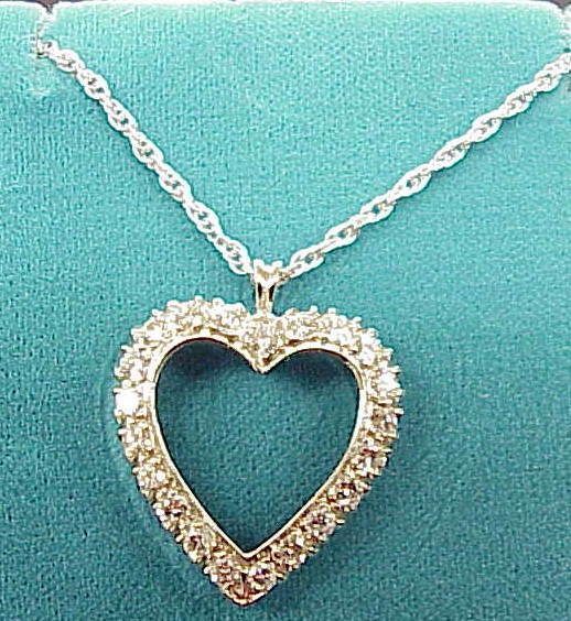 Appraisal: JEWELRY One K white gold diamond heart with round brilliant