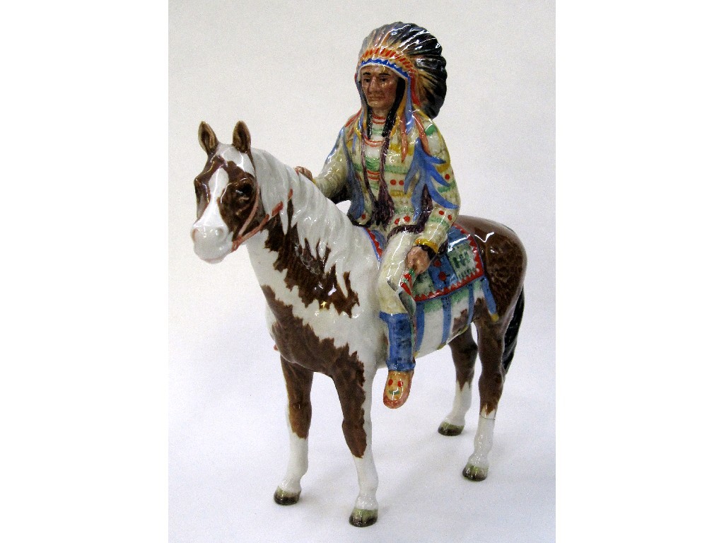 Appraisal: Beswick mounted Indian on skewbald pony back left leg broken