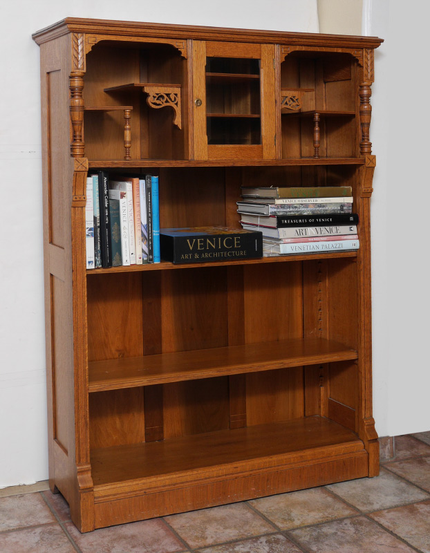 Appraisal: EASTLAKE CARVED GOLDEN OAK BOOKCASE Top section with single center