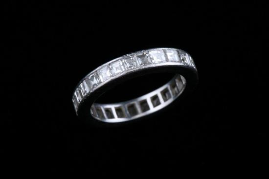 Appraisal: PLATINUM AND DIAMOND GUARD BAND Circle of square-cut diamonds together