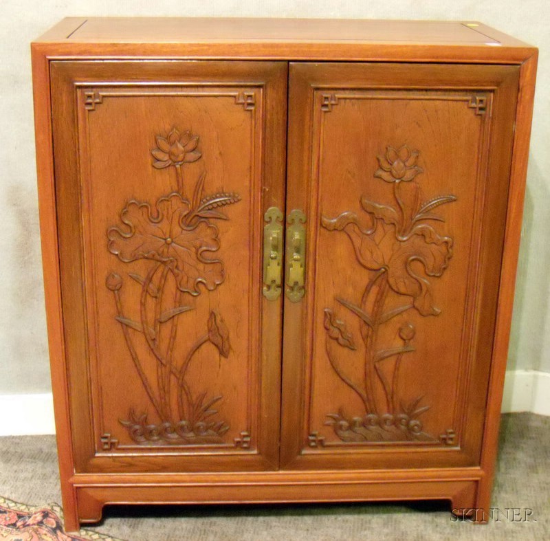 Appraisal: Asian Export Lotus Decorated Carved Teak Two-Door Side Cabinet the