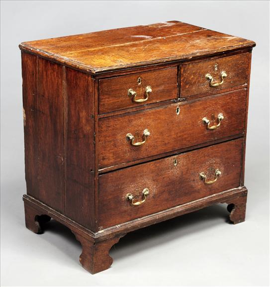 Appraisal: A George III oak chest of drawers circa of two