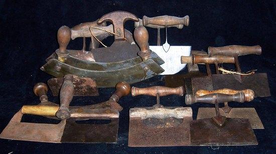 Appraisal: Two mezzaluna cutters and a quantity of single handled cutters