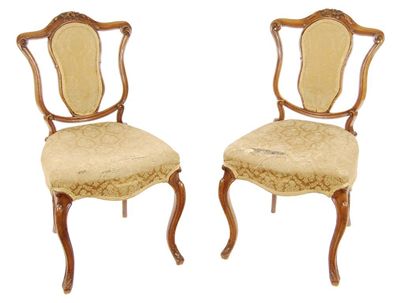 Appraisal: A pair of Victorian carved walnut boudoir chairs