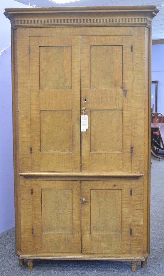 Appraisal: One-piece pine corner cupboard with original ochre faux birds-eye curly