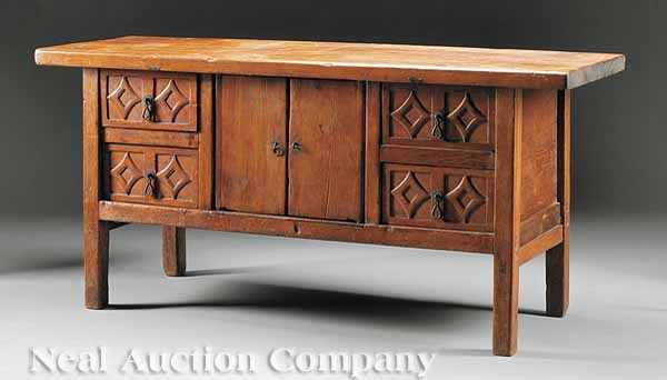 Appraisal: An Arts and Crafts Walnut Credenza plank top above a