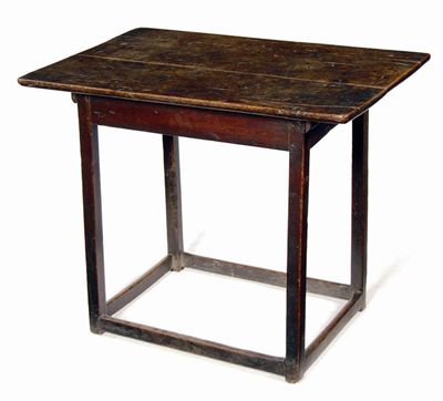 Appraisal: An early th century oak table the boarded top to