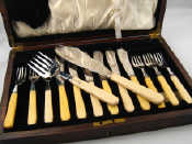 Appraisal: Six pairs of silver plated fish eaters with servers in