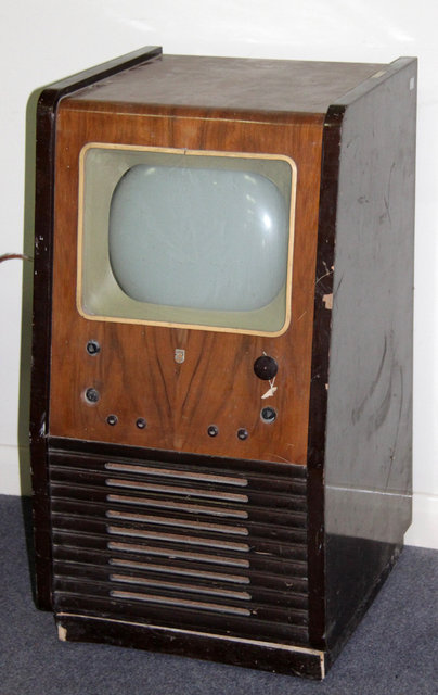 Appraisal: A Philips television circa in a walnut veneered case with