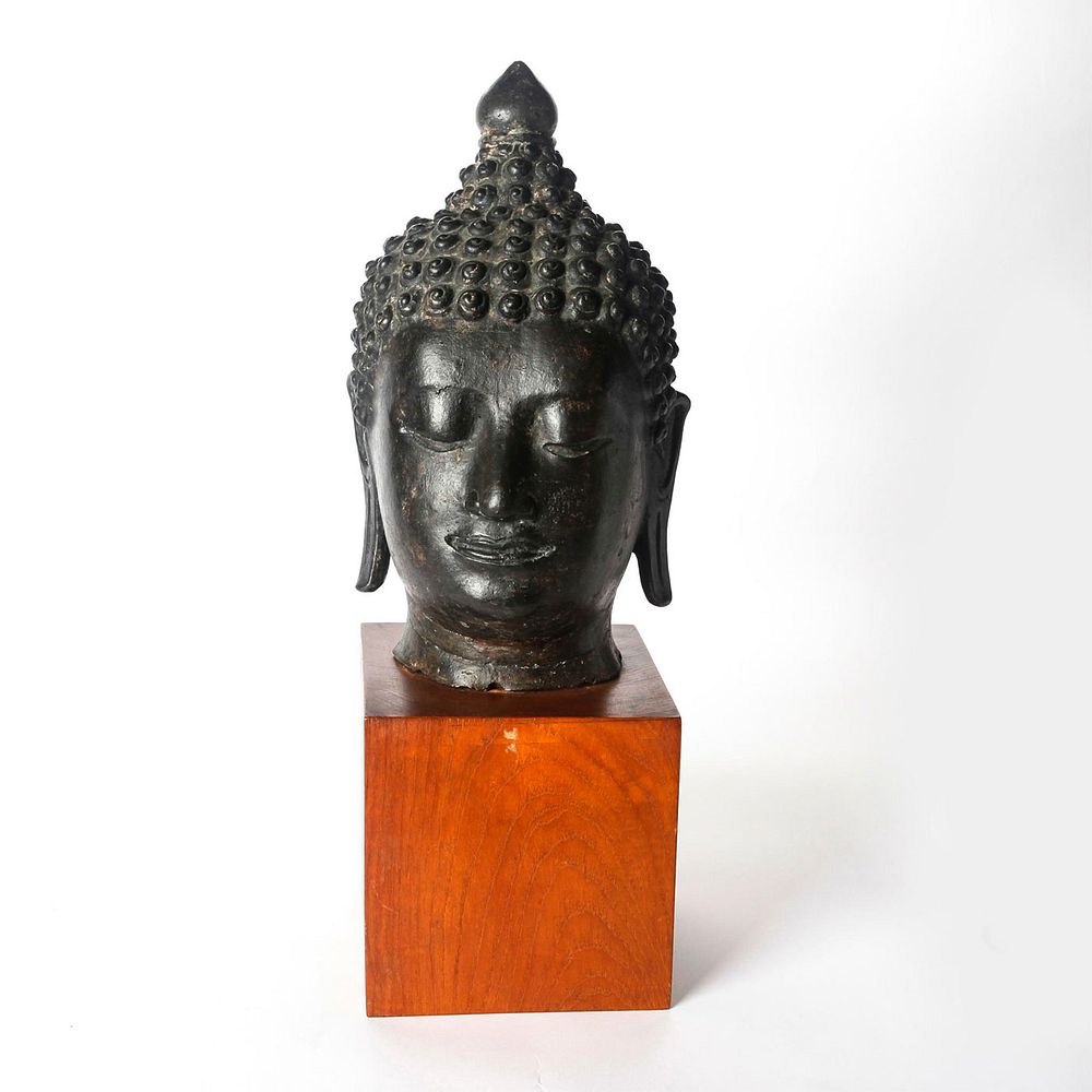 Appraisal: SOUTH ASIAN BRONZE HEAD OF BUDDHA ON WOODEN BASE c