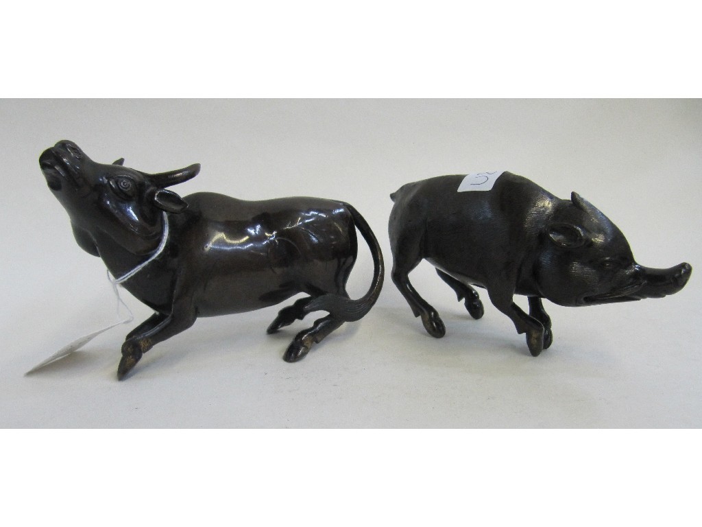 Appraisal: Lot comprising two bronzed metal figures of animals - pig