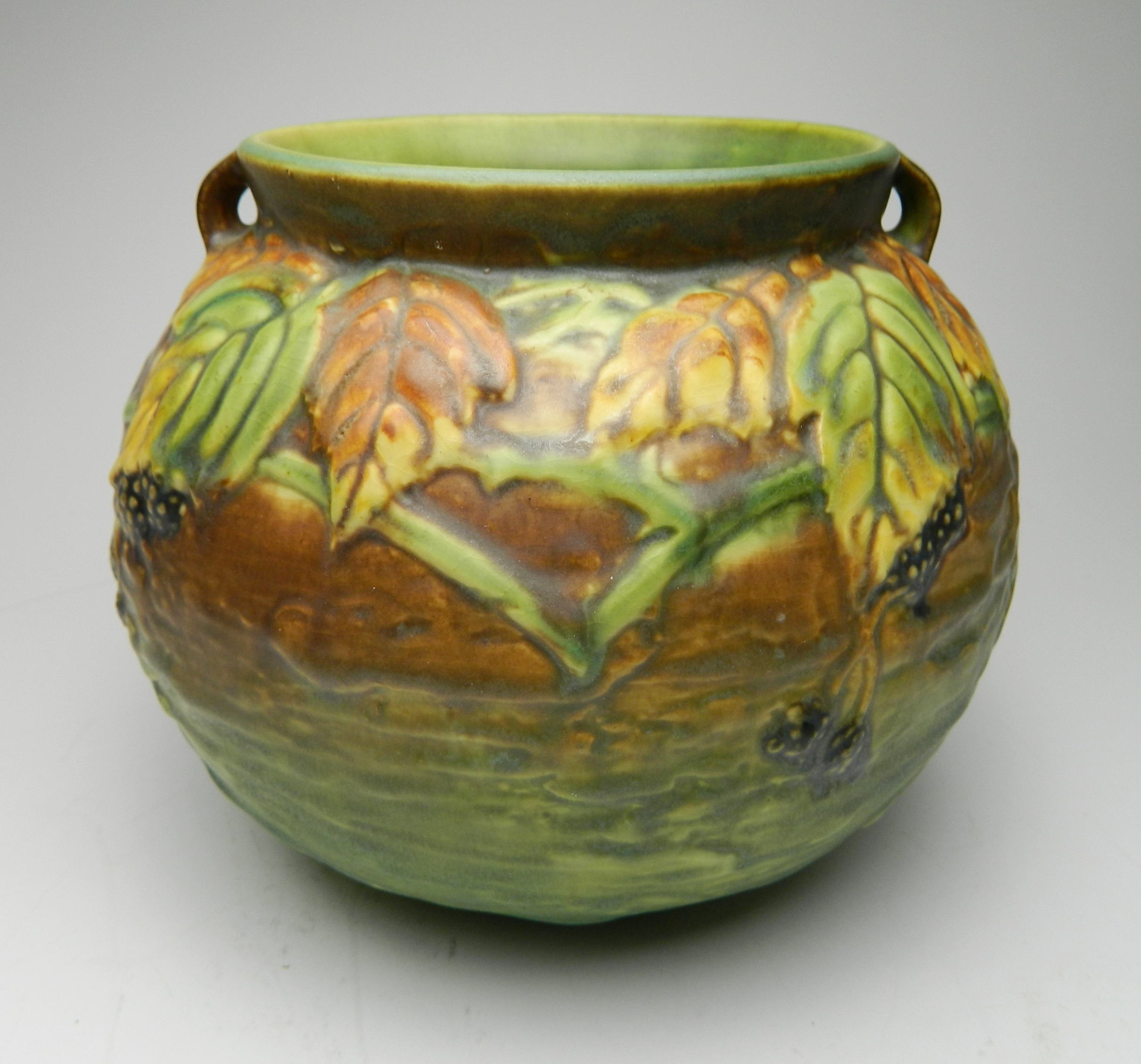 Appraisal: Roseville pottery Blackberry vase ca pattern design by Frank Ferrell