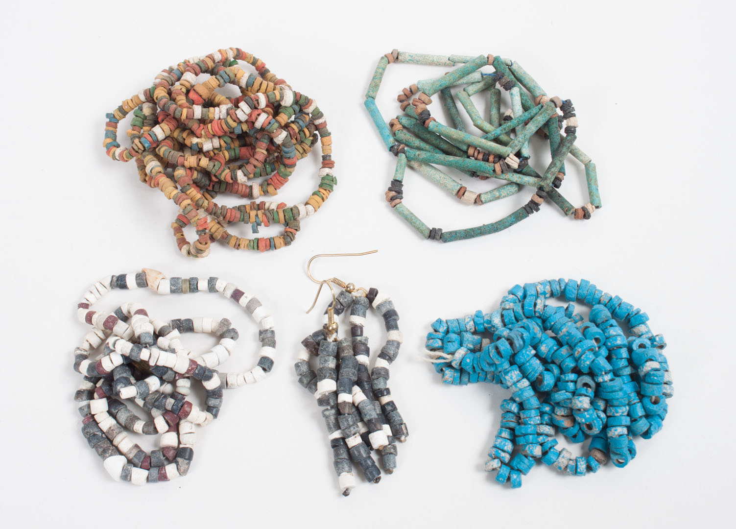 Appraisal: Four Ancient Egyptian faience and stone beads necklaces and a