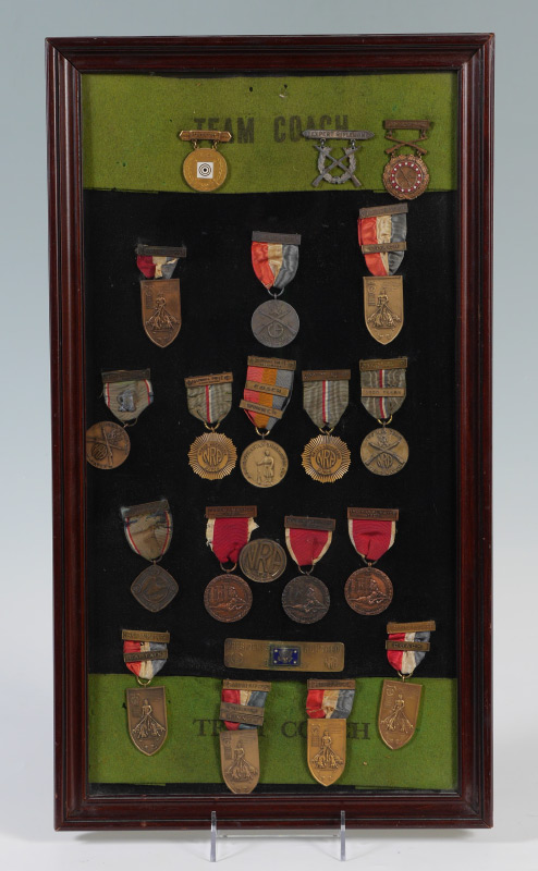 Appraisal: FRAMED COLLECTION OF SHOOTING MEDALS medals total primarily ribbon type