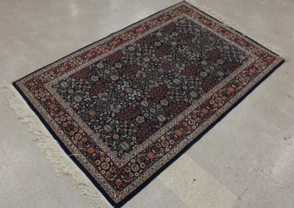 Appraisal: HAND KNOTTED ORIENTAL CARPET Indo-Persian overall floral design on blue