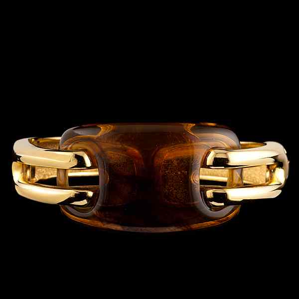 Appraisal: Givenchy Amberlite Bangle A gold tone bracelet with side hinge