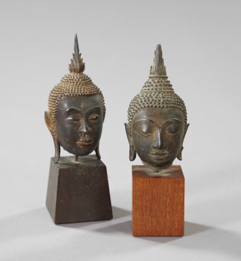 Appraisal: Near-Pair of Thai Parcel-Gilt Patinated Bronze Buddha Heads first quarter