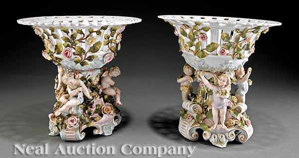 Appraisal: A Pair of Continental Polychrome and Gilt-Decorated Figural Porcelain Corbeilles