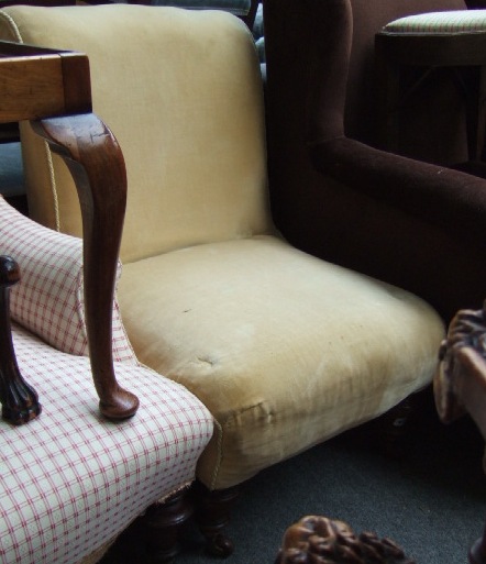 Appraisal: A th century mahogany framed scroll back nursing chair raised