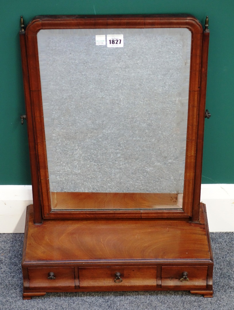 Appraisal: A George II fruitwood toilet mirror with three drawer base