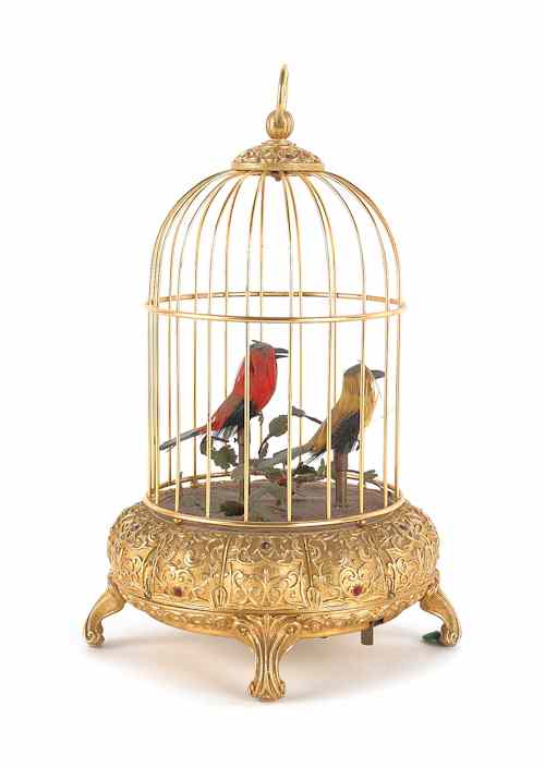 Appraisal: Gilt metal bird cage with two singing birds th c