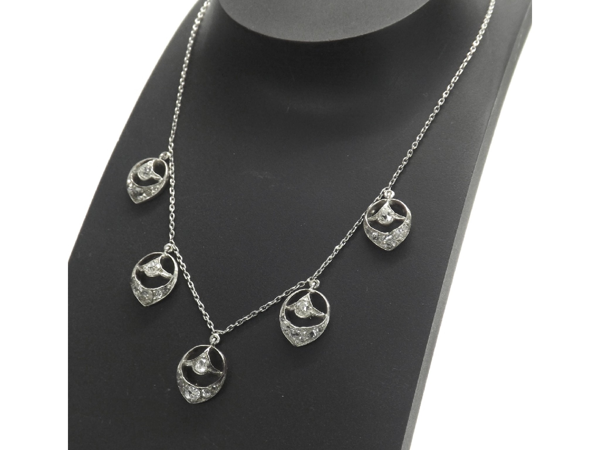 Appraisal: Art Deco diamond set necklet with five suspended oval drops